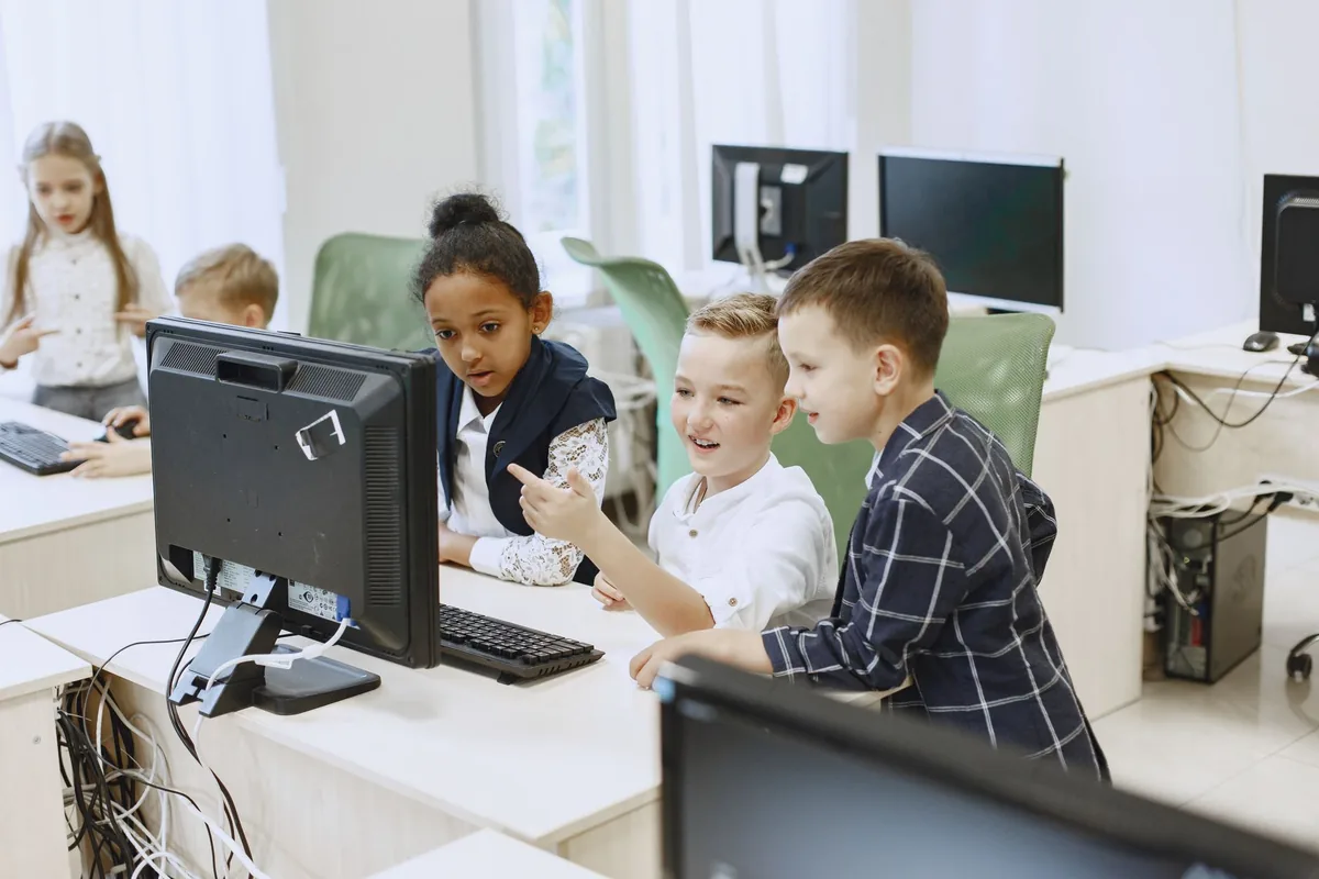 A student using a phone at a classroom desk