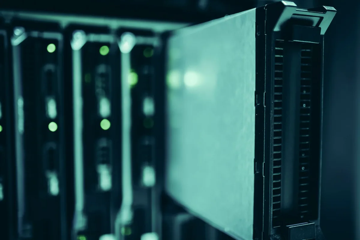 Rows of servers glowing in a data center